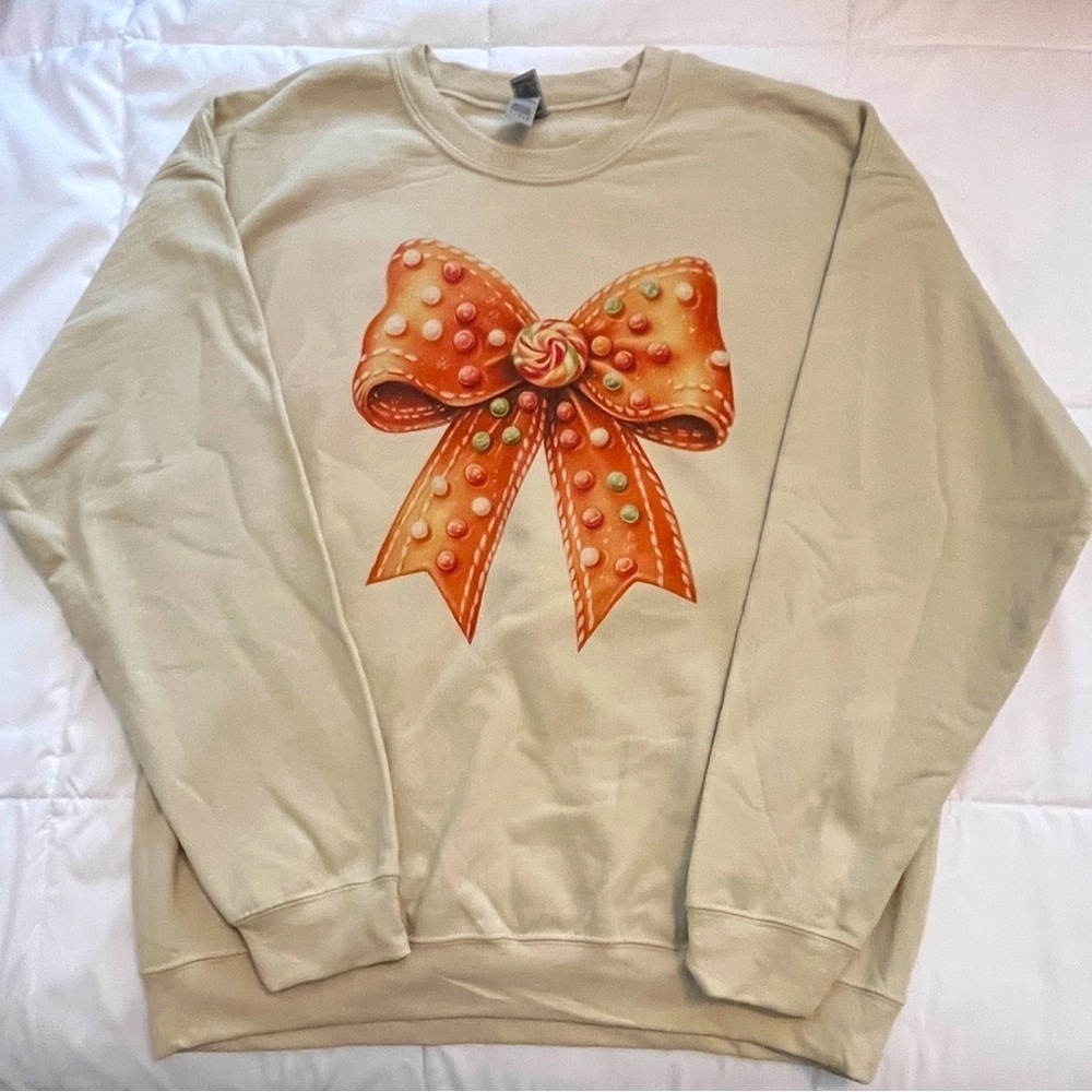 Cream Sweatshirt with Orange Gingerbread Bow. Size L. NWOT